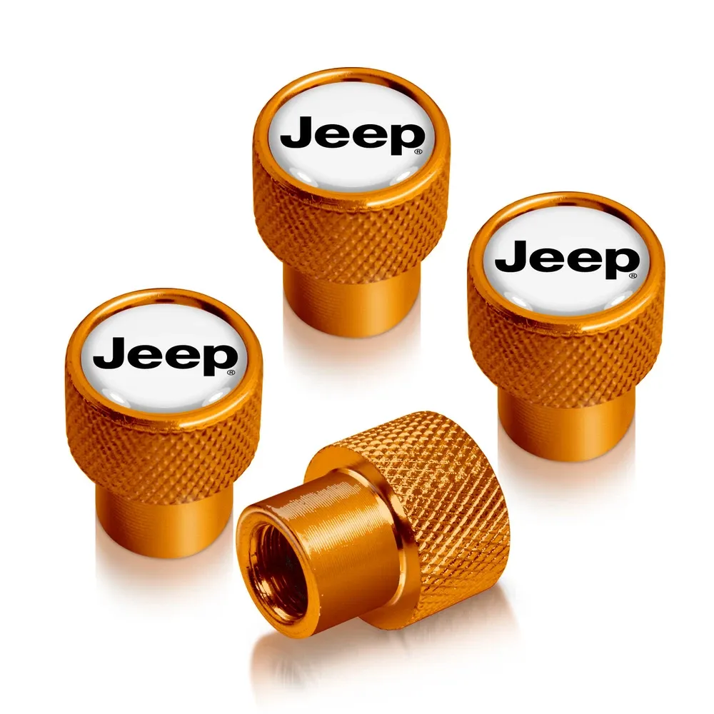 Колпачки ниппелей Jeep на белом фоне в золотистом корпусе — фото 1