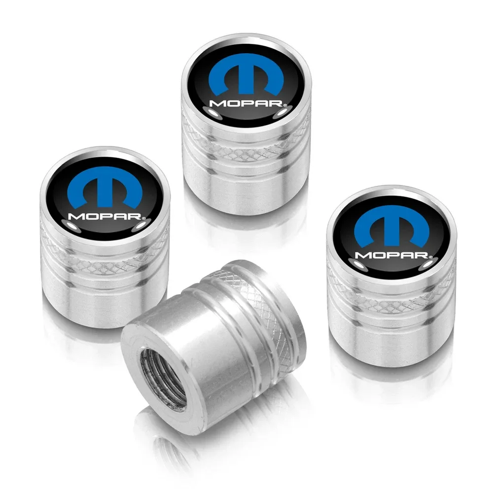 Колпачки ниппелей Mopar на черном фоне on Shining серебристая Aluminum Cylinder-Style Tire Valve Stem Caps — фото 1